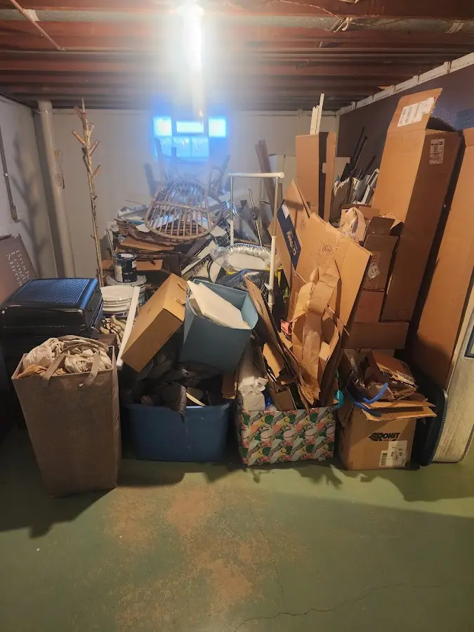 Roll-off dumpster container at job site for 20 Yard Dumpster Rental in Okauchee Lake